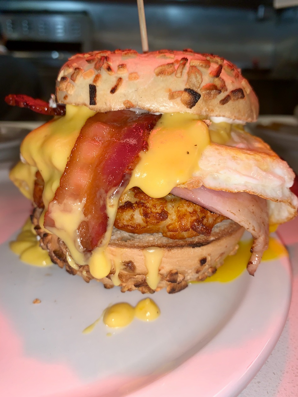 Bagel Benedict with ham and bacon