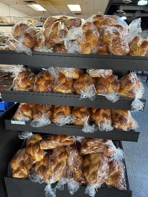 Braided challahs bagged and ready in our retail display