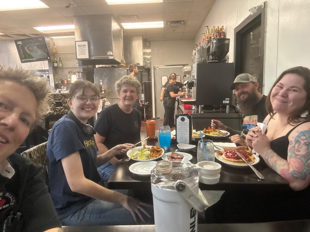 The NYBB team sharing breakfast together at a table