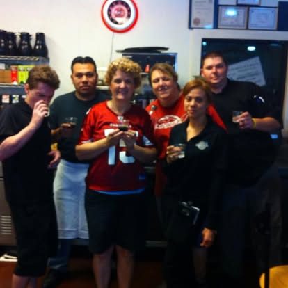 Six NYBB team members raising their glasses together