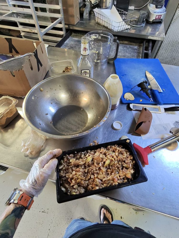 A tub of freshly prepped apple and walnut filling
