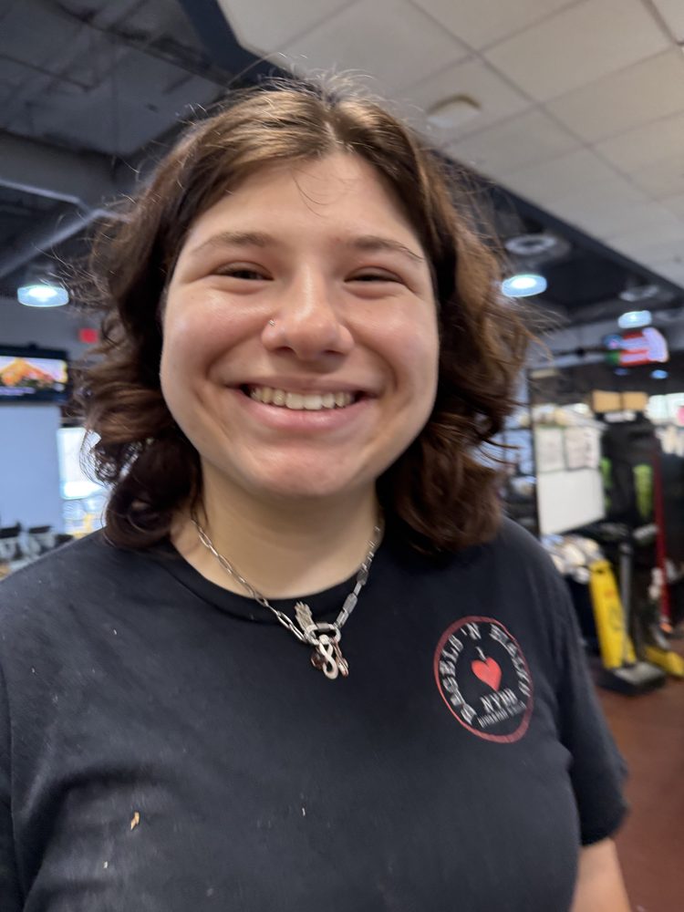 A smiling NYBB team member on shift