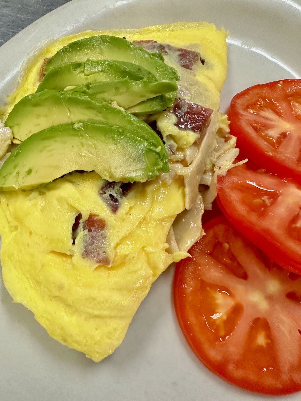 Omelette with avocado and tomato