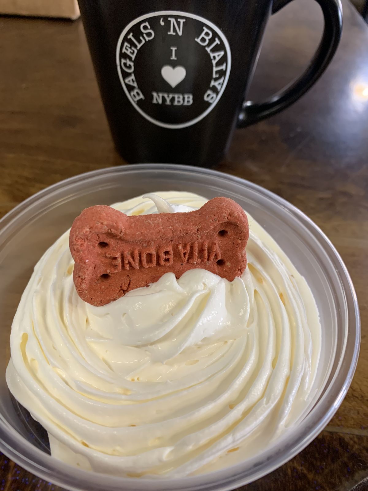 Puppuccino with a milk bone in an NYBB mug