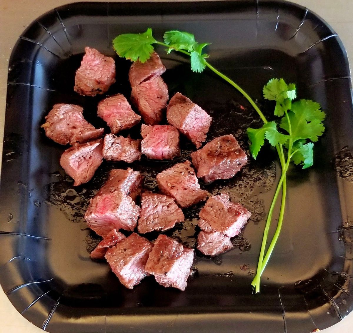 Steak bites for pups, served on a tray